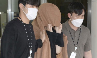 A woman leaves the Seoul Central District Prosecutors' Office in Ulsan