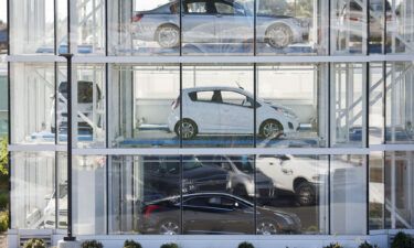 Vehicles sit inside a Carvana Co. car vending machine in Westminster