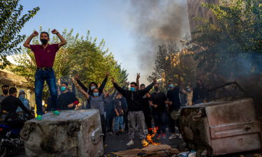 Iranians protest the death of 22-year-old Mahsa Amini on October 27 after she was detained by the morality police last month in Tehran