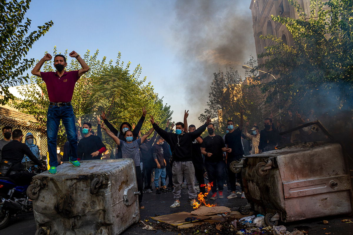 <i>Stringer/Middle East Images/File</i><br/>Iranians protest the death of 22-year-old Mahsa Amini on October 27 after she was detained by the morality police last month in Tehran