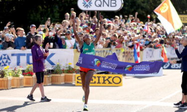 Gebreslase breaks the tape at the World Athletics Championships.