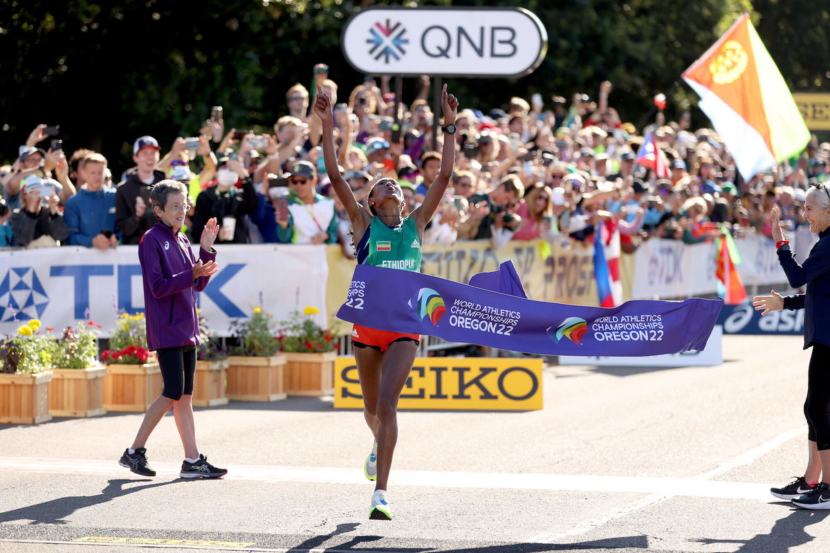 <i>Ezra Shaw/Getty Images</i><br/>Gebreslase breaks the tape at the World Athletics Championships.