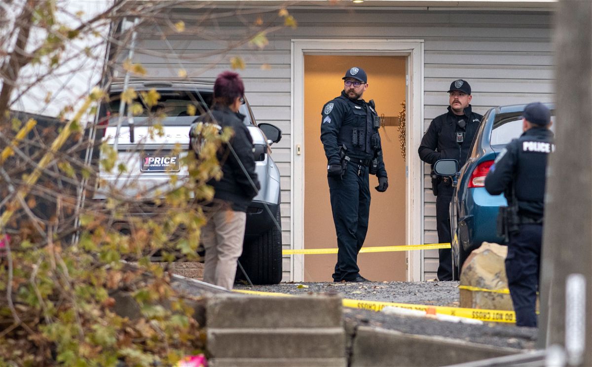 <i>Zach Wilkinson/The Moscow-Pullman Daily News/AP</i><br/>Officers investigate a homicide at an apartment complex south of the University of Idaho campus on Sunday