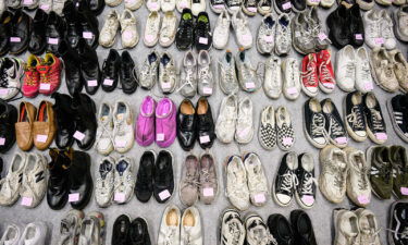 A total of 256 pairs of shoes were lined up at the gymnasium -- 66 did not have a pair.