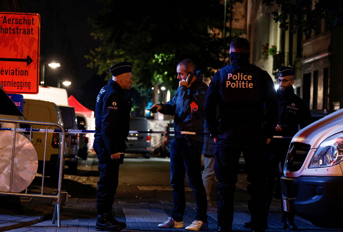 <i>Kenzo Tribouillard/AFP/Getty Images</i><br/>Police officers stand guard near the scene of a stabbing attack in Brussels on November 10. The stabbing attack is 