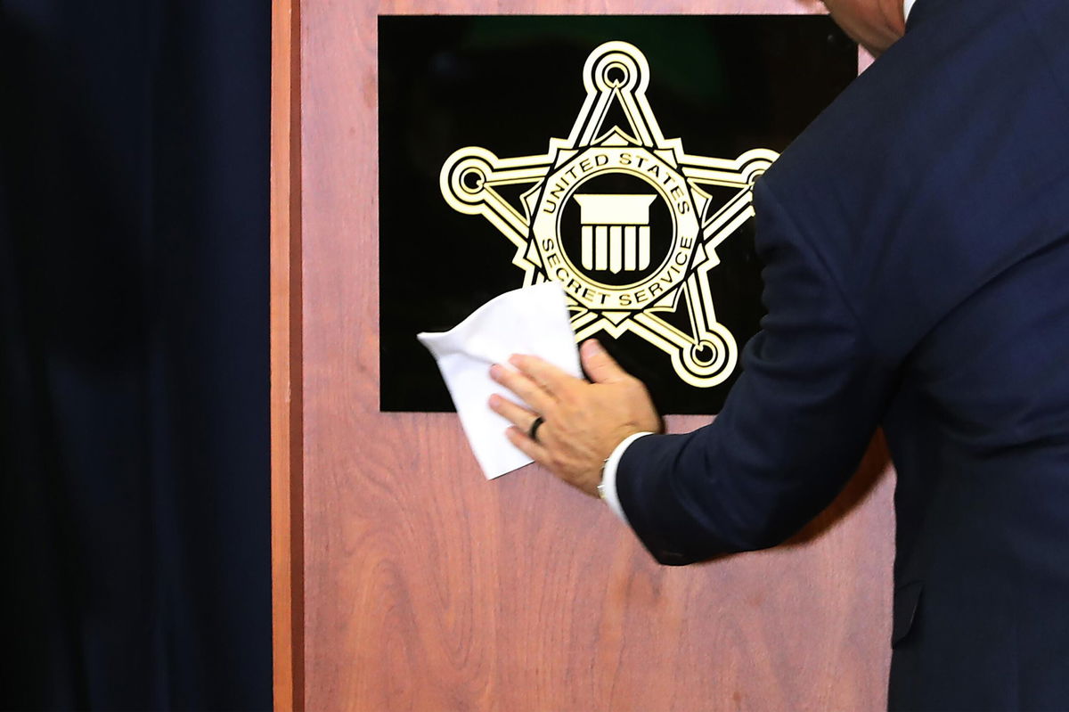 <i>Chip Somodevilla/Getty Images</i><br/>A sign with the US Secret Service shield is cleaned before a briefing at the service's headquarters in November 2019