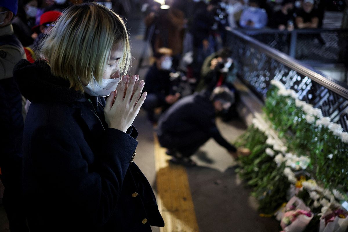 <i>lee_ji_han_fansclub/Reuters</i><br/>People pay tribute near the scene of the stampede during Halloween festivities