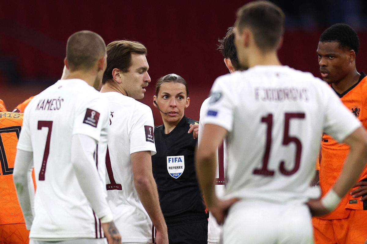 <i>Dean Mouhtaropoulos/Getty Images</i><br/>Stéphanie Frappart talks to the players during the FIFA World Cup 2022 Qatar qualifying match between the Netherlands and Latvia in March 2021.