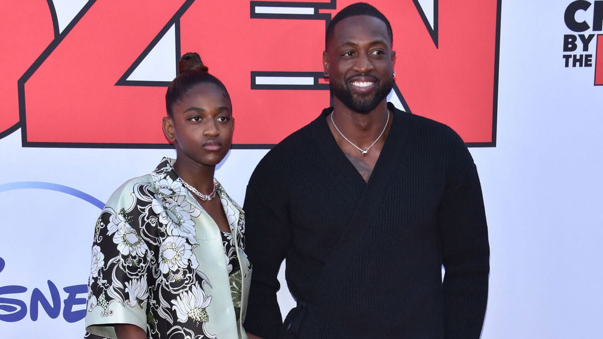 <i>Chris Delmas/AFP/Getty Images</i><br/>Dwayne Wade (right) and his daughter Zaya Wade arrive for the 