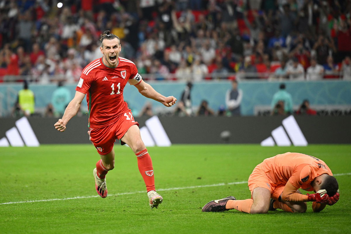 <i>Clive Mason/Getty Images</i><br/>Gareth Bale celebrates after scoring their team's equalizer at the Ahmad Bin Ali Stadium.