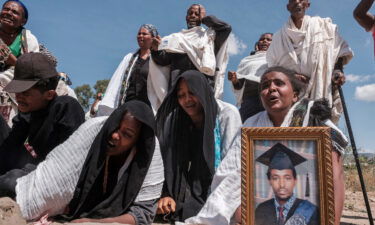 Tigrayans grieve by a mass grave in the city of Wukro