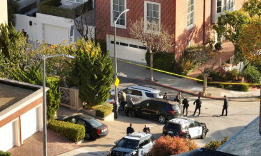 Police officers and F.B.I. agents gather in front of the home of U.S. Speaker of the House Nancy Pelosi on October 28