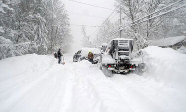 Good Samaritans help dig out a plow Friday in Hamburg