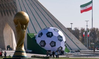 Sculptures of the FIFA World Cup trophy and a soccer ball are seen here in the west of Tehran on November 18. The families of Iran's World Cup soccer team have been threatened if the players fail to "behave" ahead of the match against the USA on November 28.