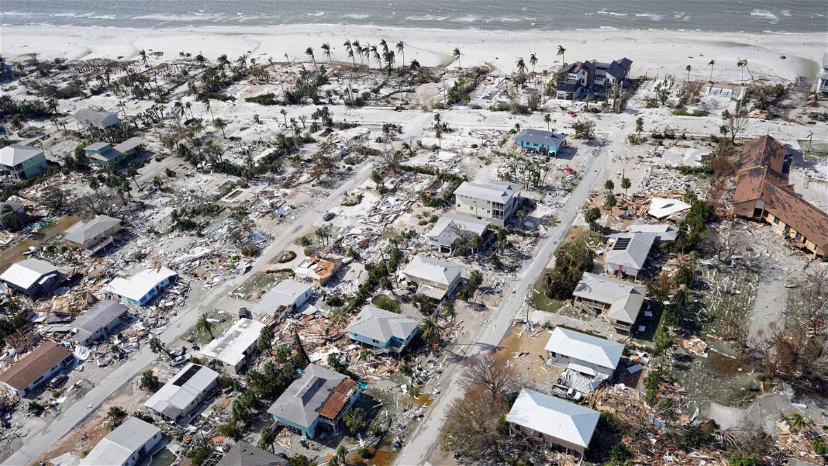 <i>Wilfredo Lee/AP</i><br/>This aerial photo shows damaged homes and debris in the aftermath of Hurricane Ian