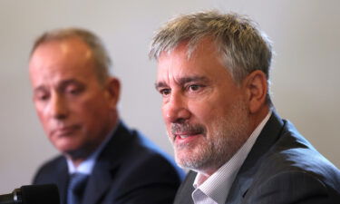 Boston Bruins president Cam Neely (right) speaks to reporters during Bruins Media Day in Boston on October 10. Neely announced Sunday the team is parting ways with Mitchell Miller.