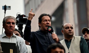 Pakistan's former Prime Minister Imran Khan (center)