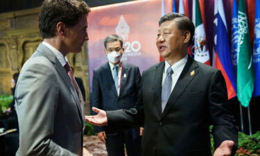 Chinese leader Xi Jinping (right) was captured by broadcasters in a rare candid moment on November 16