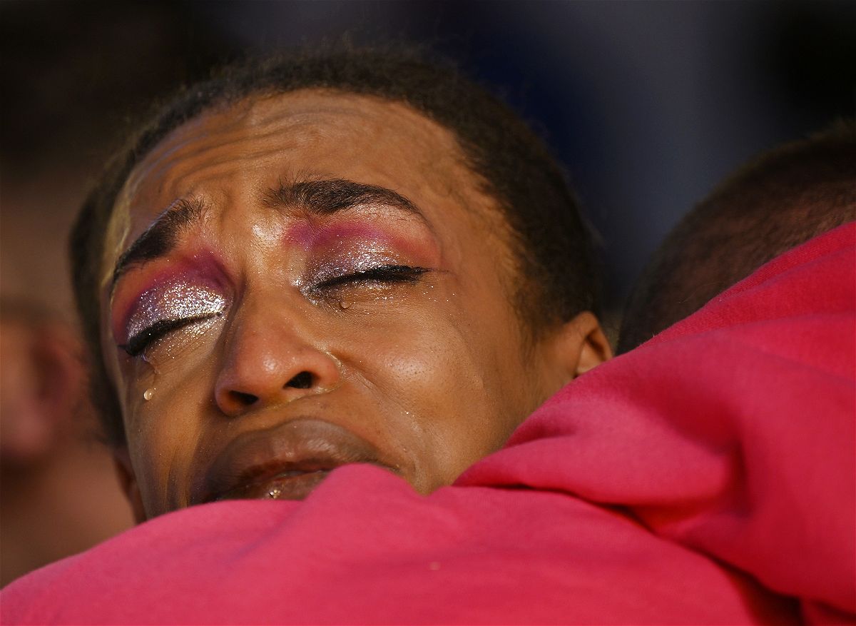 Leia-jhene Seals hugs R.J. Lewis at a vigil for the victims of the Saturday night Club Q shooting at All Souls Unitarian Church on Sunday, Nov. 20, 2022, in Colorado Springs, Colo. Seals was performing when a 22-year-old gunman entered the LGBTQ nightclub, killing at least several people and injuring multiple others. Lewis was also at the nightclub. (RJ Sangosti/The Denver Post via AP)