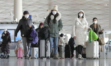 Passengers at the departure hall in Beijing's international airport on December 27.