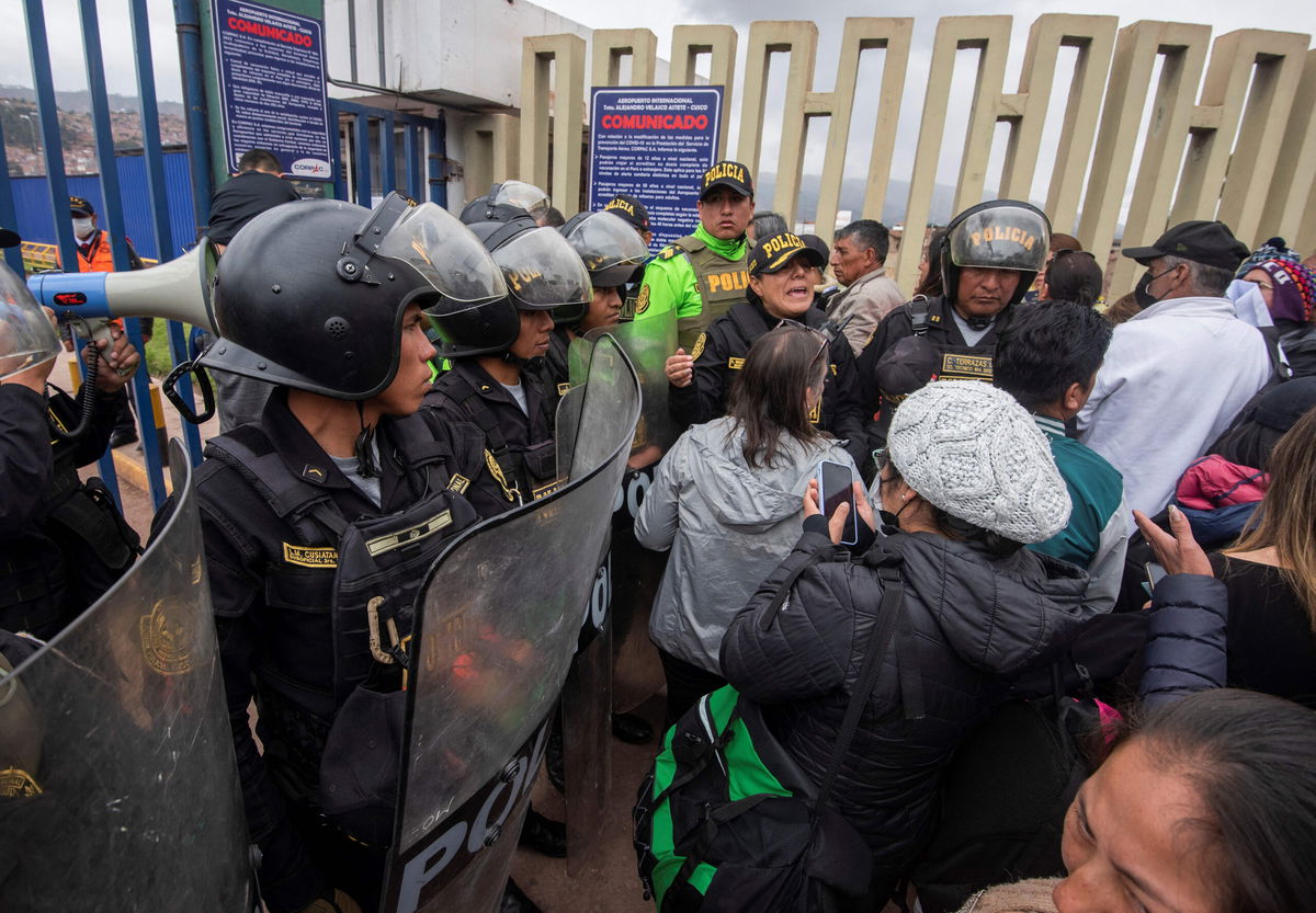 <i>Ivan Flores/AFP/Getty Images</i><br/>Police guard the entrance to the Alejandro Velasco Astete International Airport