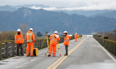 Thousands are still without power after a California earthquake. Transportation workers are seen here assessing damage to a bridge after the earthquake.