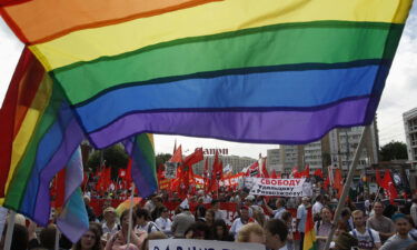 Gay rights activists take part in an opposition protest march in Moscow