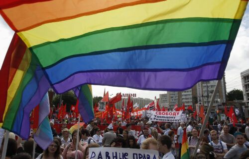 Gay rights activists take part in an opposition protest march in Moscow