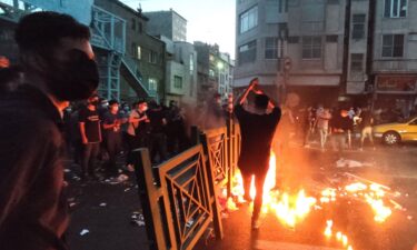 Iranian demonstrators take to the streets of the capital Tehran during a protest for Mahsa Amini