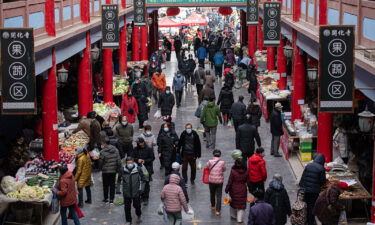 Residents shop for vegetables at a wet market in Taiyuan