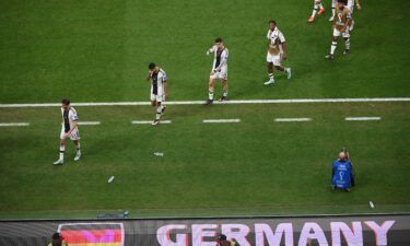 Germany players leave the pitch after they failed to qualify for the last 16 of the 2022 World Cup.