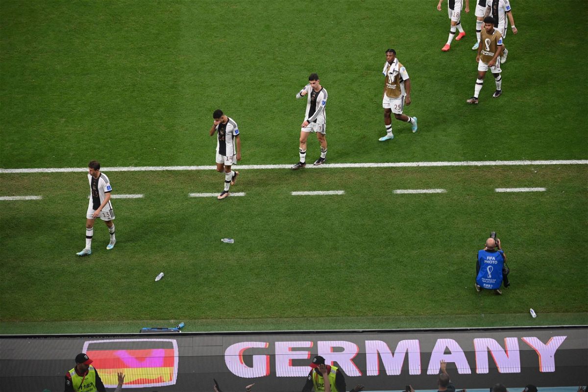 <i>FRANCK FIFE/AFP/AFP via Getty Images</i><br/>Germany players leave the pitch after they failed to qualify for the last 16 of the 2022 World Cup.