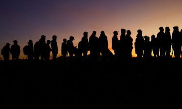 The Biden administration is still bracing for the end of a Trump-era border restriction even after the chief justice of the Supreme Court temporarily paused the end of the program. Venezuelan migrants stand near the Rio Bravo river on December 17.