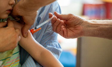 A young child receives a Moderna Covid-19 vaccine in Needham