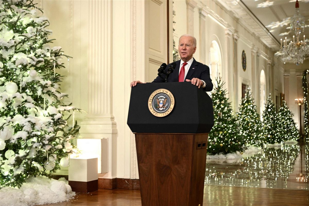 <i>BRENDAN SMIALOWSKI/AFP/AFP via Getty Images</i><br/>US President Joe Biden delivers a Christmas address from the Cross Hall of the White House in Washington