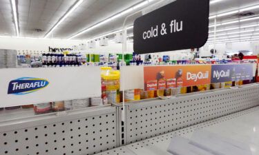 A cold and flu medicine shelf is empty in a CVS pharmacy on December 6