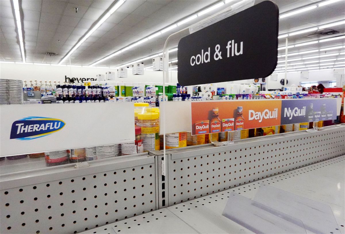 A cold and flu medicine shelf is empty in a CVS pharmacy on December 6