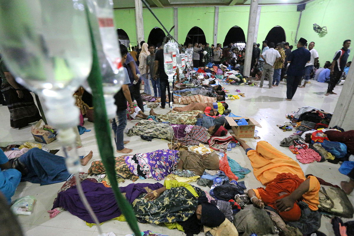 <i>Amanda Jufrian/AFP/Getty Images</i><br/>A group of Rohingya refugees at a temporary shelter at the Ujong Pie village