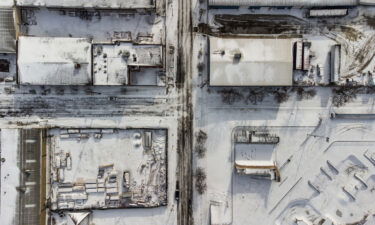 Snow-covered buildings are seen in Louisville