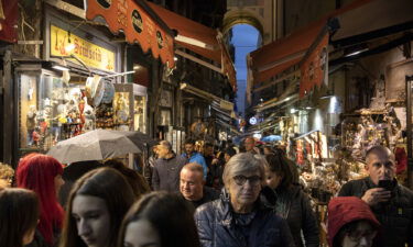 Italy implements one-way foot traffic in 'dangerously' overtouristed street. People walk in a touristic area in Naples