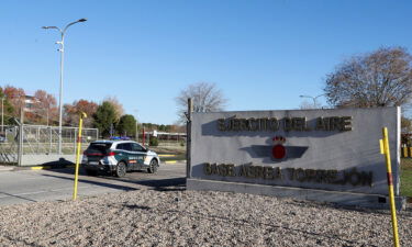 A police vehicle is seen entering the Torrejon air base near Madrid on Thursday after a suspected explosive device was found hidden in an envelope that was mailed there.