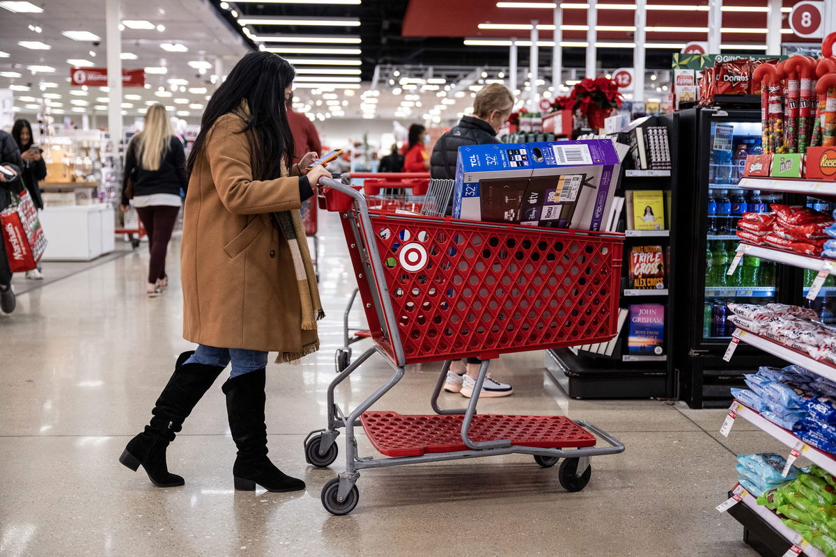 <i>Christopher Dilts/Bloomberg/Getty Images</i><br/>Shoppers wait in line to checkout at a Target store on Black Friday in Chicago