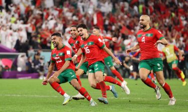 Morocco players celebrates after the team's victory in the penalty shootout against Spain.