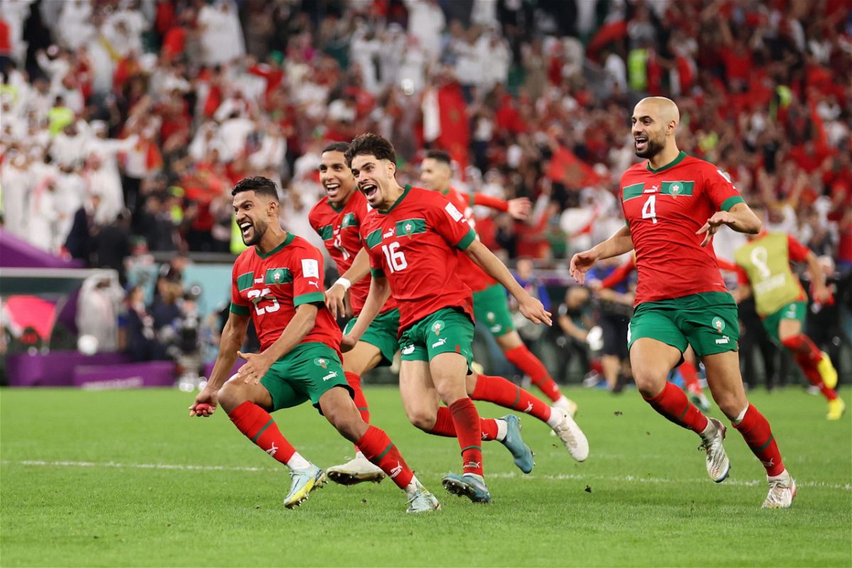 <i>Julian Finney/Getty Images AsiaPac/Getty Images</i><br/>Morocco players celebrates after the team's victory in the penalty shootout against Spain.