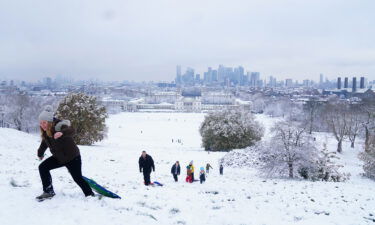 People sledging in the snow at Greenwich Park in London on Monday.