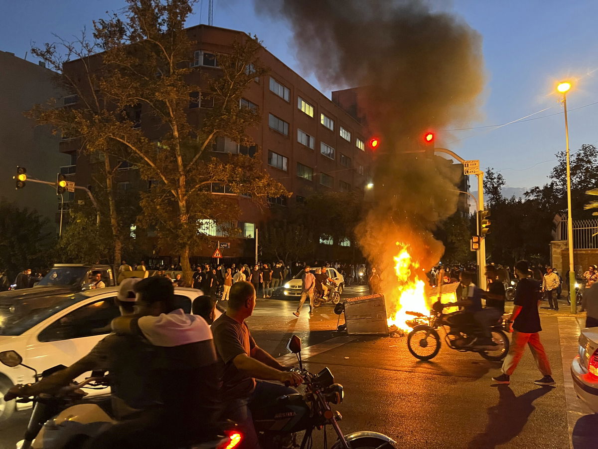 <i>AP</i><br/>Iran hangs a man in the first known execution linked to protests that have swept the country since September. Scenes from a protest in central Tehran on September 19.