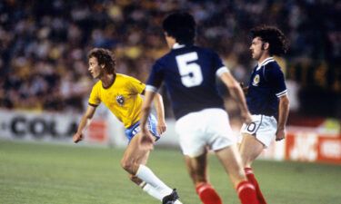 Scotland's John Wark (right) defends Falcao during the group stage clash.
