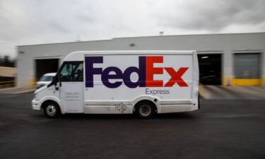 A delivery truck leaves a FedEx Express facility on Cyber Monday in Garden City