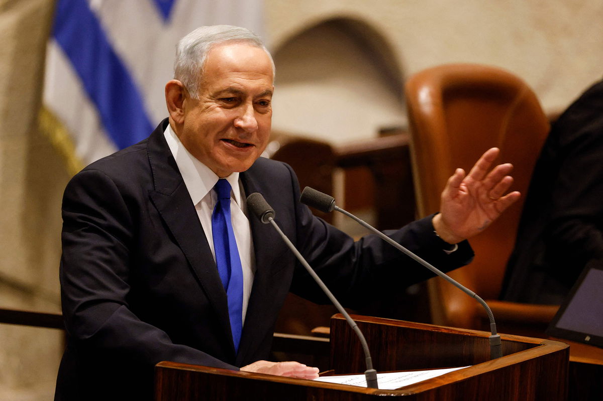 <i>Amir Cohen/AFP/Getty Images</i><br/>Israel's Benjamin Netanyahu presents the new government to parliament at the Knesset in Jerusalem on December 29.