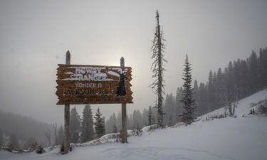 A welcome sign sits at the top of Teton Pass in December 2021